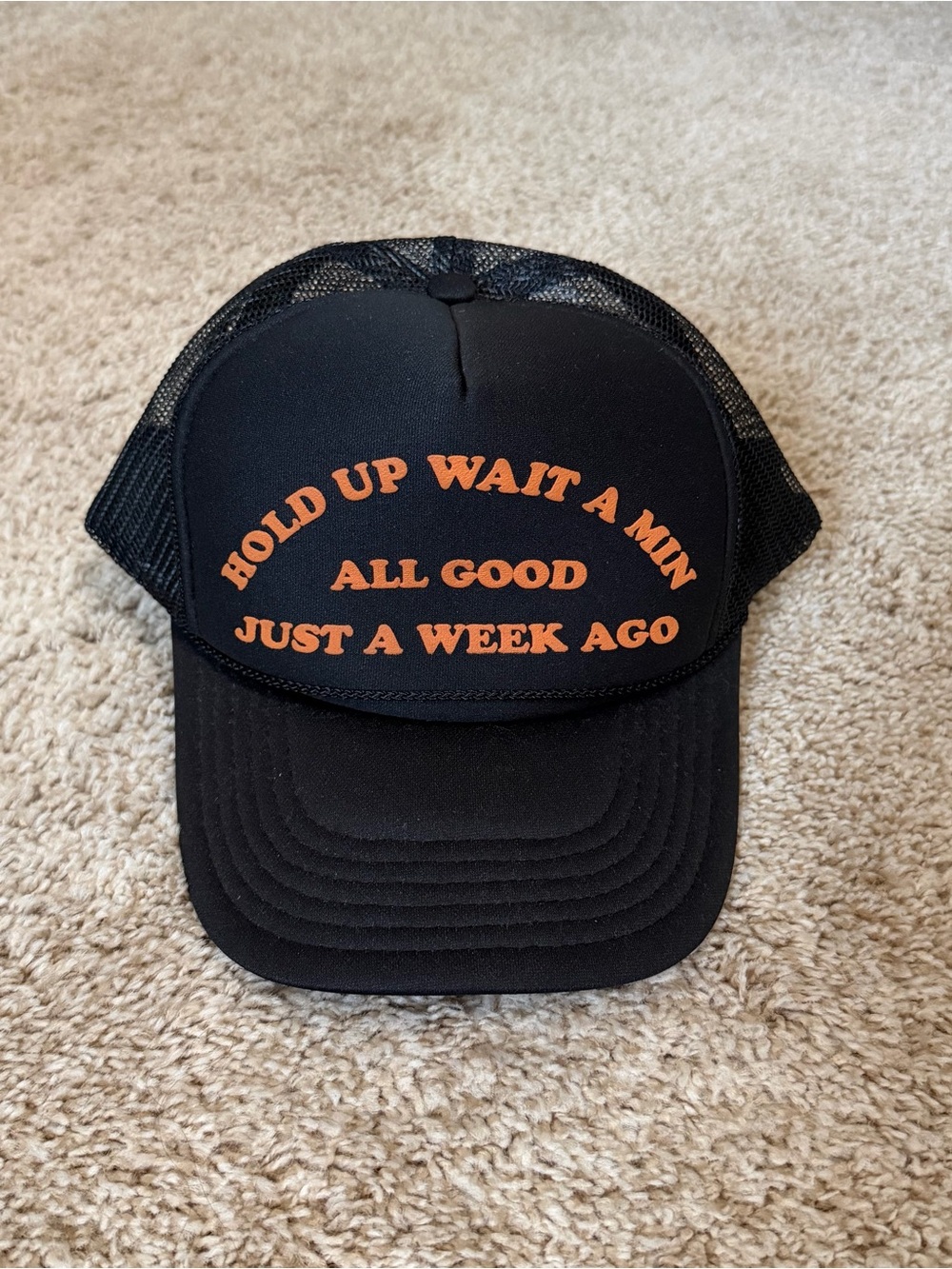 Black Trucker Hat with Orange Slogan